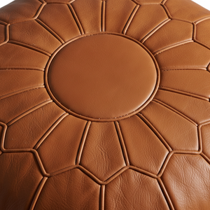 Close-up stitching detail of Moroccan leather pouf
