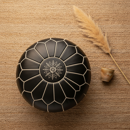 Flat lay of black Moroccan leather pouf