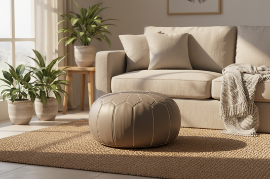 Grey Moroccan leather pouf in cozy living room setting