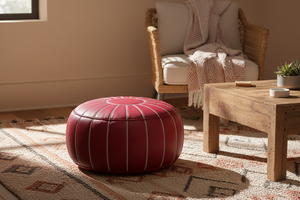 Red Moroccan leather pouf in cozy living room setting