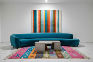 Striped rug in teal marble gallery living room