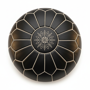 Top-down close-up of black Moroccan leather pouf