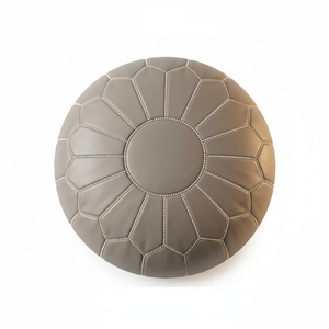 Top-down close-up of grey Moroccan leather pouf